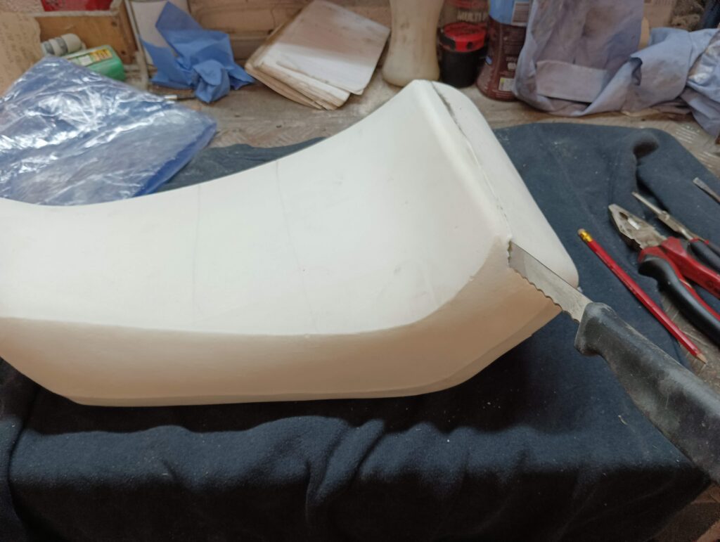 The cover comes off easily, revealing the naked seat underneath